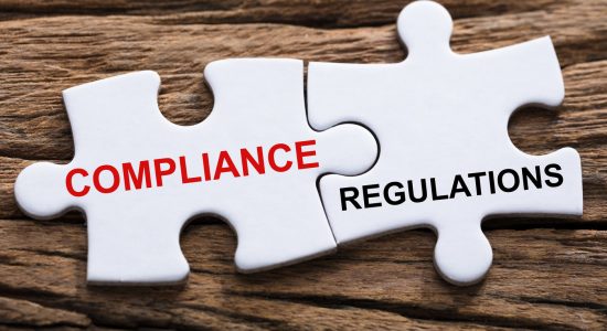 An Elevated View Of Compliance And Regulations Word Written On P An Elevated View Of Compliance And Regulations Word Written On Pieces Of Jigsaw Puzzle